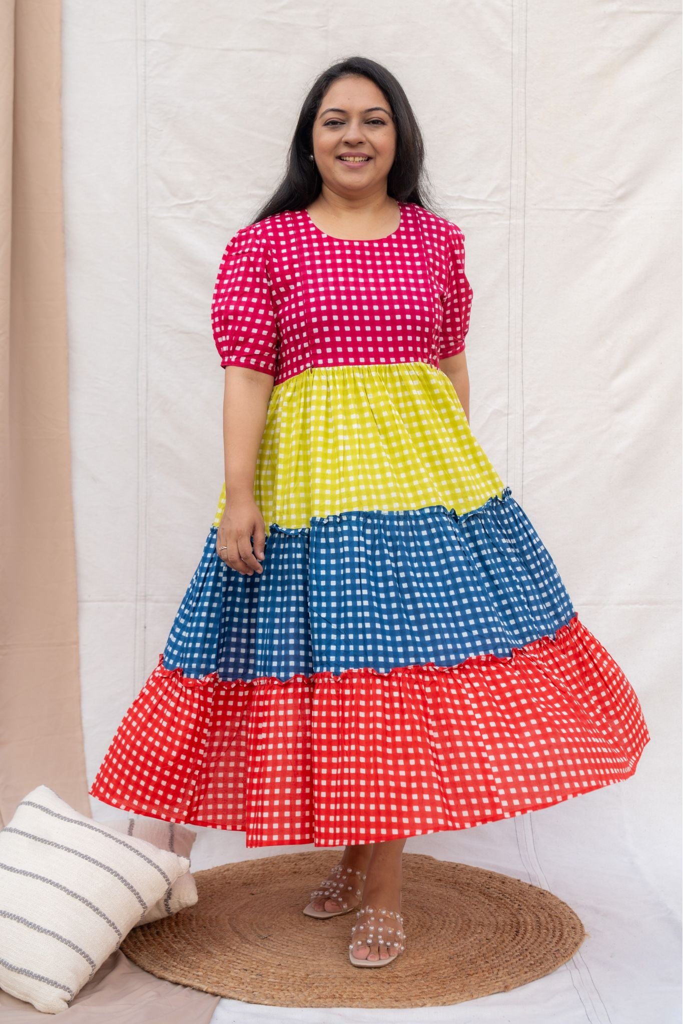 Full look of 3 layered multi -colour checks feeding friendly dress.