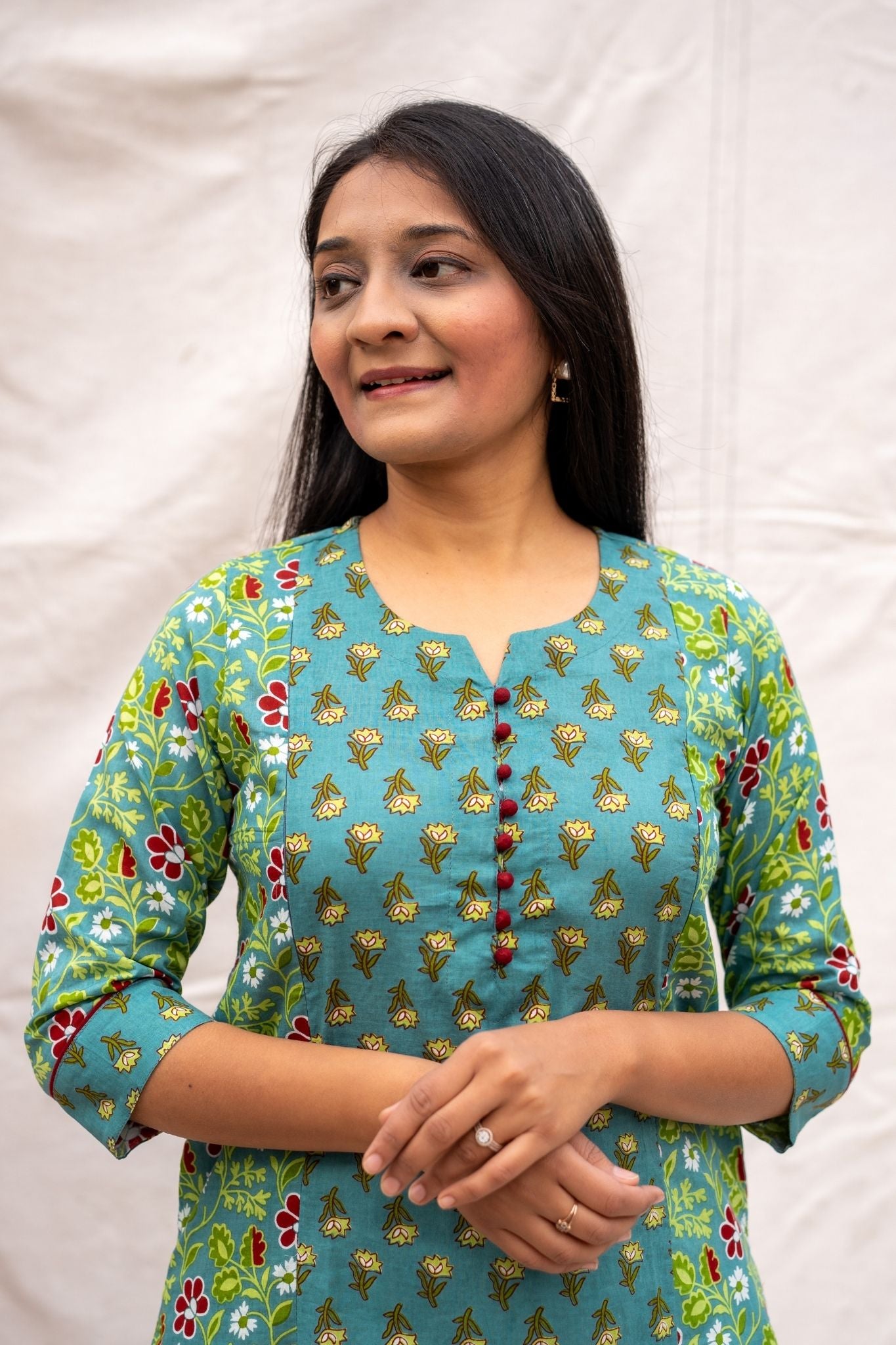 Close up view of teal nursing & feeding friednly kurta showing potli button